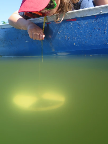A women taking water readings by Christine Desilva.
